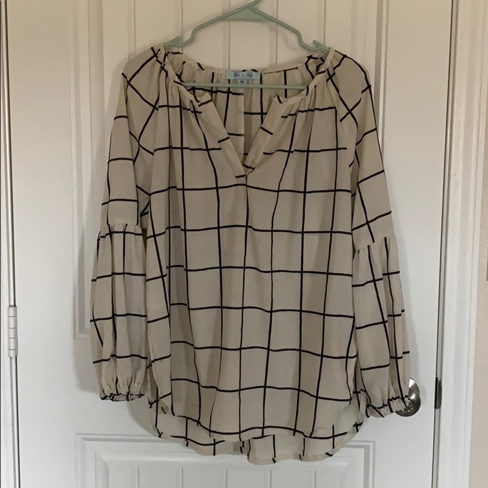 black and cream long sleeved grid shirt